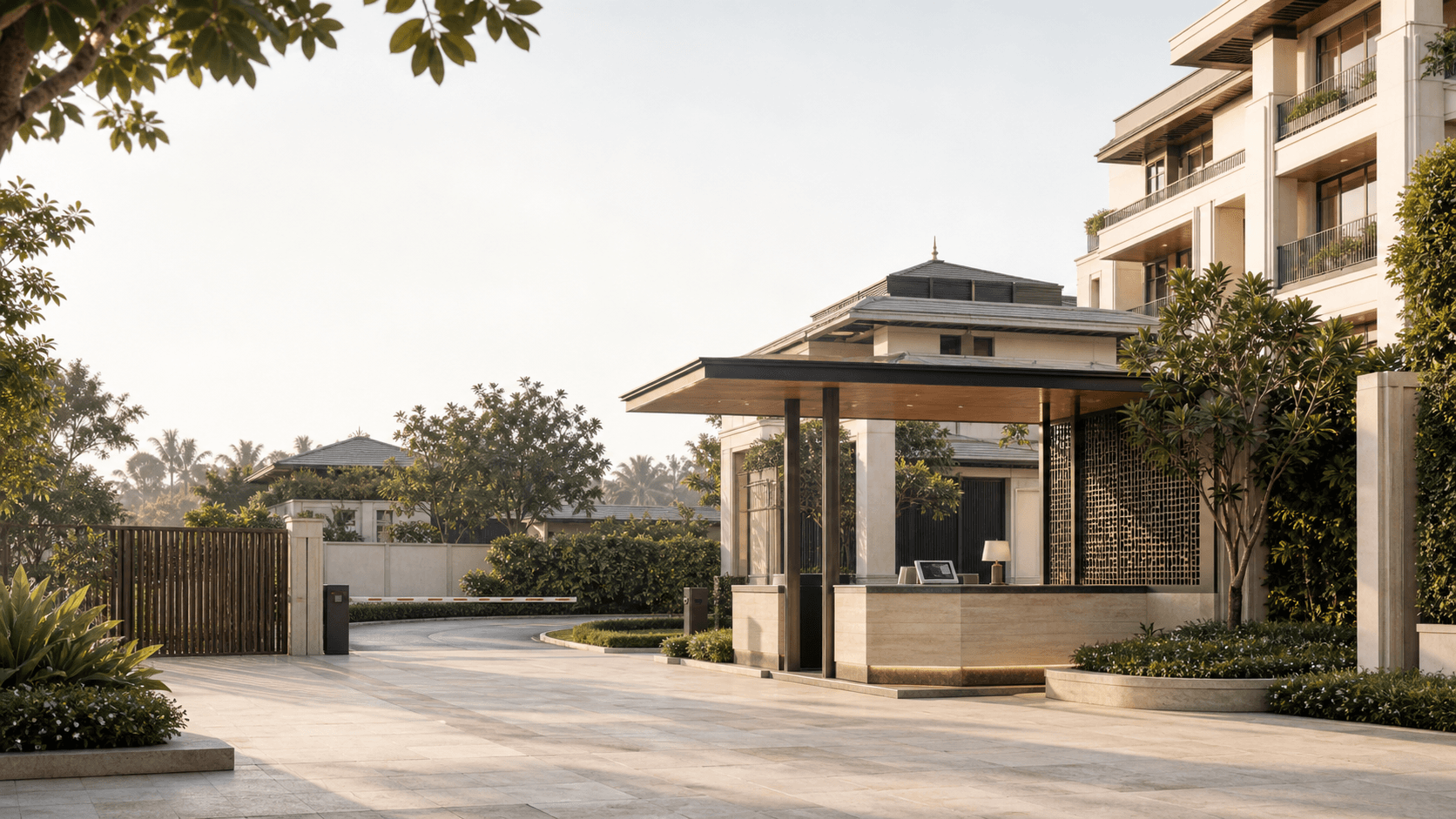 A premium residential community at twilight with gate, towers, and landscaped common areas
