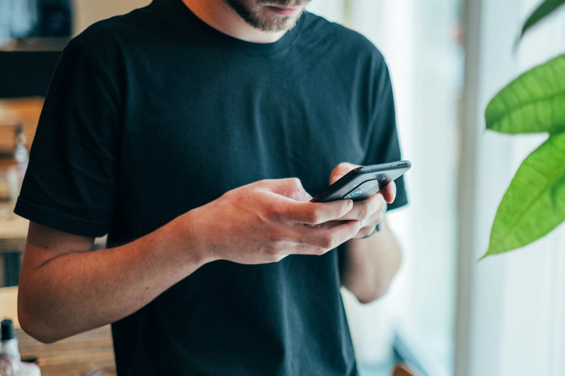 Resident using a mobile community service in a modern lobby